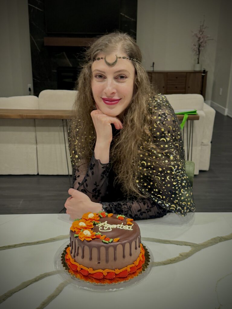 Me on Halloween with the cake my wonderful husband surprised me with